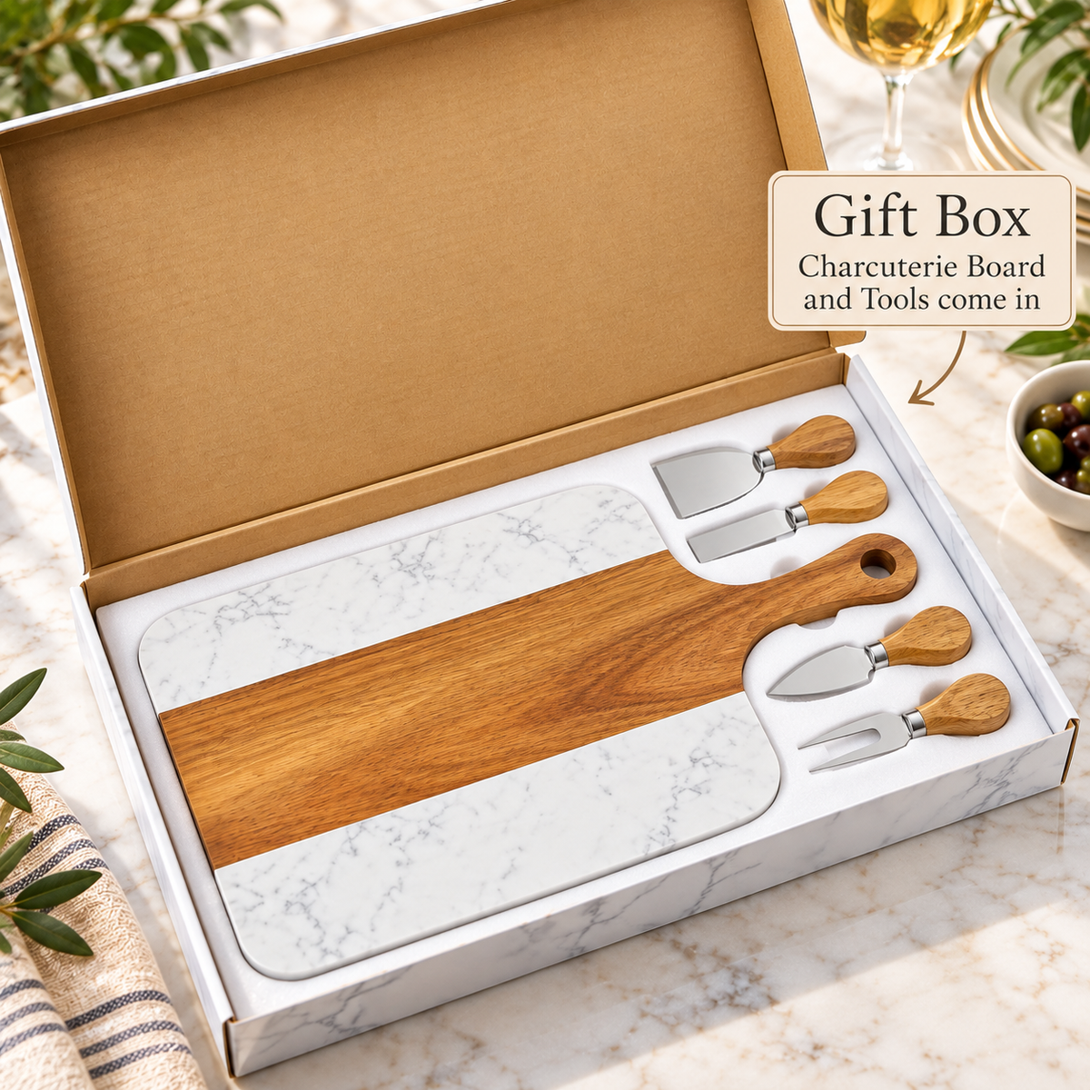 Heritage Monogram Wedding Board and four wood-handled cheese tools packed in a white gift box with a foam insert, ready to give as a wedding or engagement gift