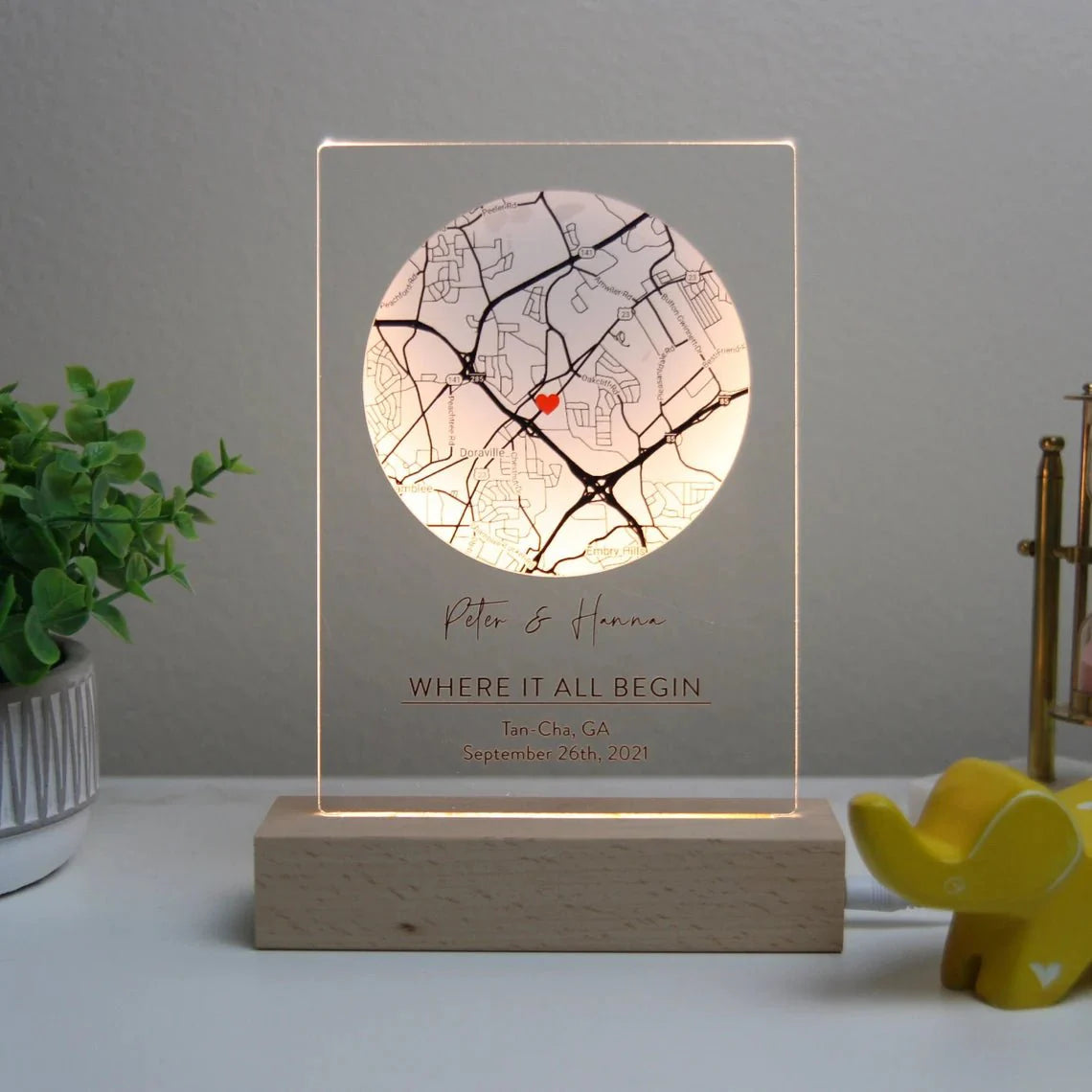 Romantic map sign personalized with custom coordinates, names, and date, available in wood or acrylic with optional LED light stand – perfect for Valentine’s Day, anniversaries, or weddings