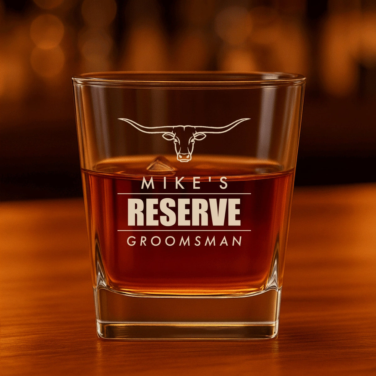 Engraved groomsmen whiskey glass reading Mike's Reserve, Groomsman under a longhorn steer, a whiskey label take on the groomsman gift