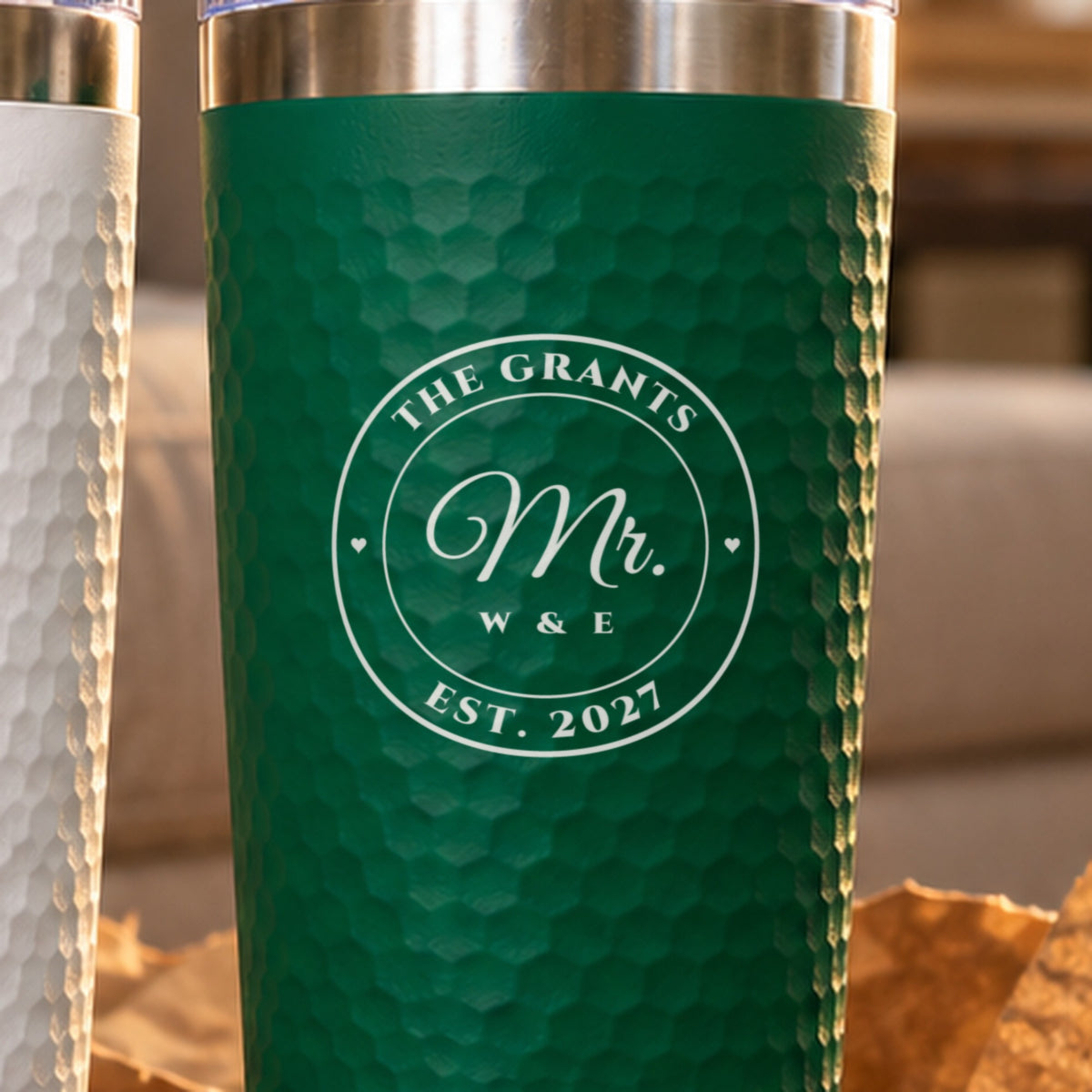 Close look at the laser engraved seal on a green wedding tumbler: The Grants across the top, Mr. in script, W & E and EST. 2027