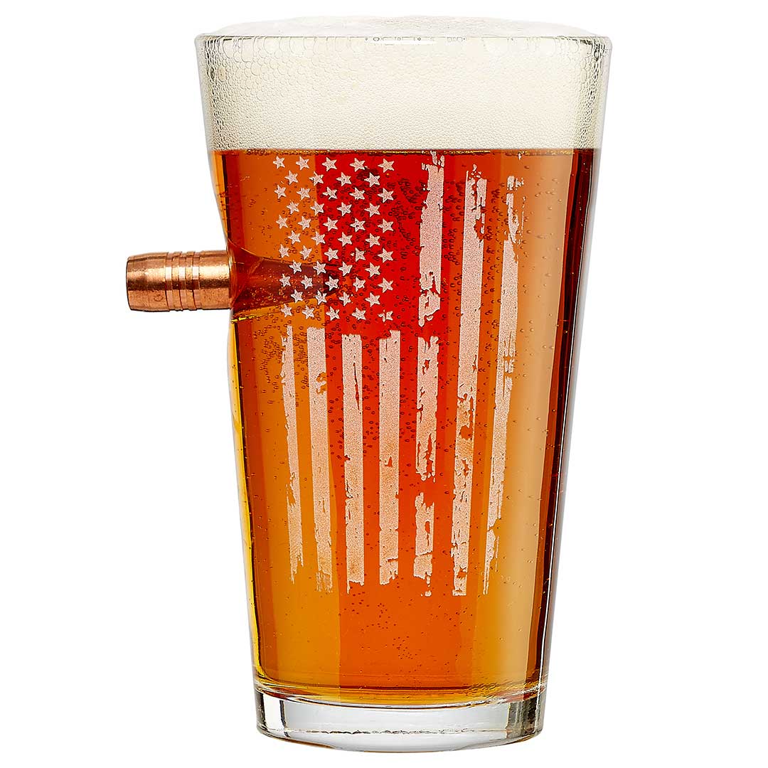 Pint glass with embedded .50 caliber bullet and etched American flag design