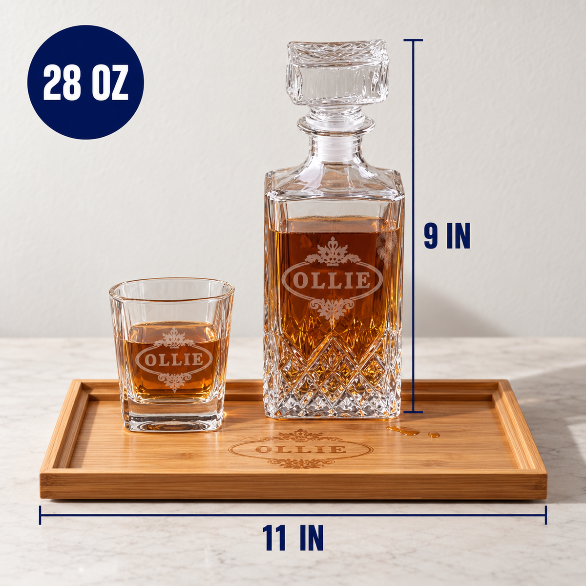 Decanter set with glasses on wooden tray showing engraved sample name "OLLIE", 28 oz capacity, 11 in wide by 9 in tall